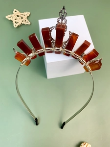 Detail of bohemian crown headband with raw reddish crystals and silver wire craftsmanship