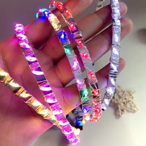 Sparkling LED light-up headbands with colorful glowing beads on silver metal bands