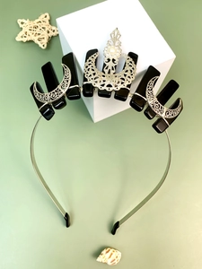 Detailed close-up of crystal bee crown headband with black stones and silver moon accents