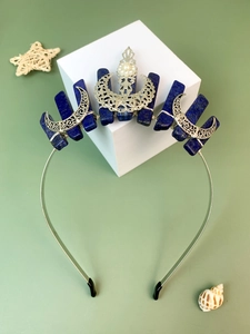 Detail of bohemian crown featuring raw blue crystals, silver moons, and pearl accents