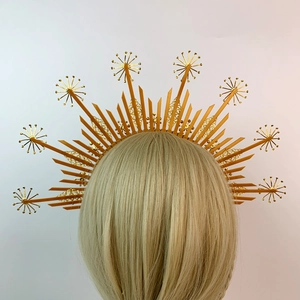 Golden sunburst halo crown headband with layered baroque metallic spikes on female model