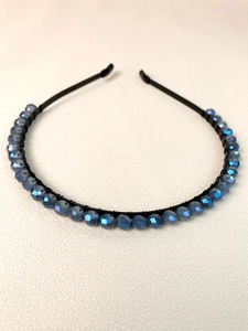 Detail view of handcrafted blue crystal beaded crown headband with black metal frame