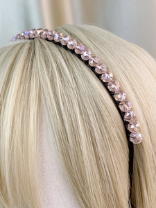 Detail view of handmade crown headband with faceted pink crystal beads on model