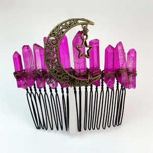 Macro detail of handmade crystal hair comb with copper moon and star accents