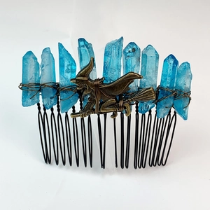 Detail of blue crystal hair comb with bronze witch on broomstick charm for hair