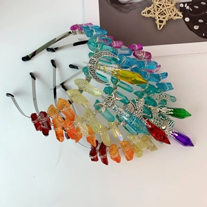 Detail of colorful crystal moon crown headband with boho celestial metal charms