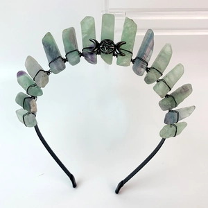 Detail of handmade black moon headband with raw fluorite crystals and triple goddess symbol