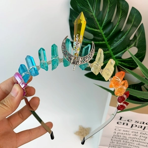 Detail view of handmade rainbow crystal headband with moon charm and wired prisms