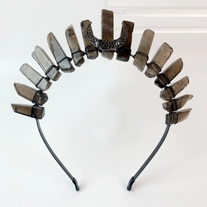 Close-up of handmade Gothic headband with smoky quartz crystals and black moon pendant