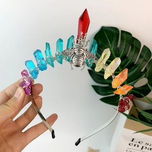 Detail of silver wire wrapped rainbow crystal stones and metal bee on the handmade headband