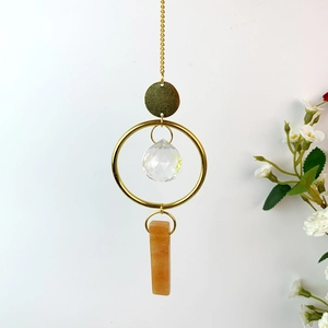 Natural crystal wind chime with round faceted glass ball and orange mineral stone pendant