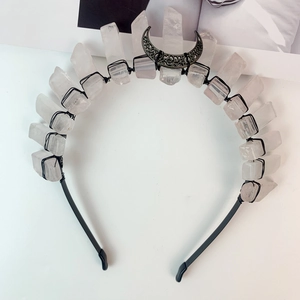 Macro detail of gothic crystal tiara with moon charm and black wire wrapping