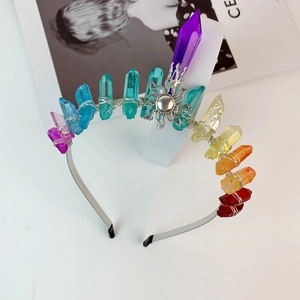 Detail view of handmade rainbow crystal crown headband with sun metal ornament