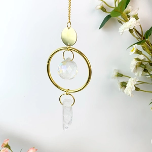 Hanging crystal suncatcher with natural raw stone and golden metal chain for home decor