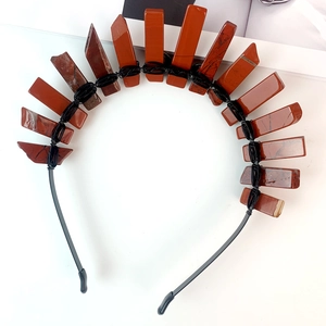 Macro shot of handmade bohemian red jasper raw stones crown with black wire wrapping