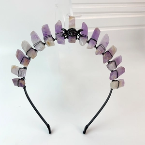 Detail of amethyst raw crystals and black metal moon goddess charm on gothic headband