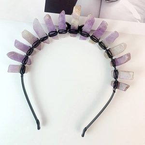 Close-up of handmade crown headband with raw purple crystals wrapped in black wire