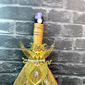 Gothic witch broom with natural amethyst, peacock feathers, and mystical metal charms