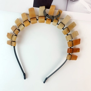 Handmade black metal headband featuring raw yellow crystal pillars and vintage crescent moon