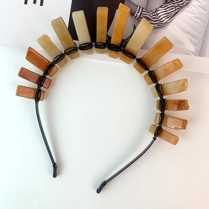 Macro detail of handmade black wire-wrapped yellow quartz stones on a crystal crown headband
