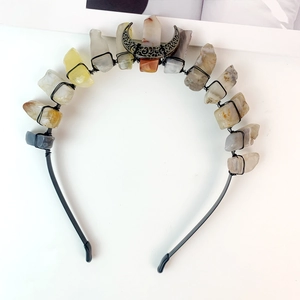 Macro shot of handmade black crystal headband with raw stones and silver moon detail