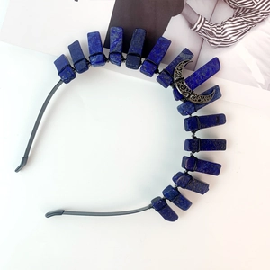Detail of handmade black headband with dark blue lapis stones and silver moon charm