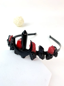 Detail of gothic crown headband with black crescent moon and dark red crystals
