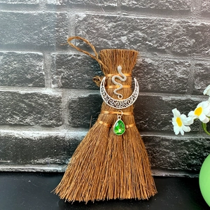 Detail of wicca mini broom car charm with silver moon snake and green crystal drop