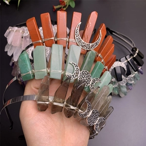 Detail of handmade crystal crown headbands with wire-wrapped natural quartz and moon charms