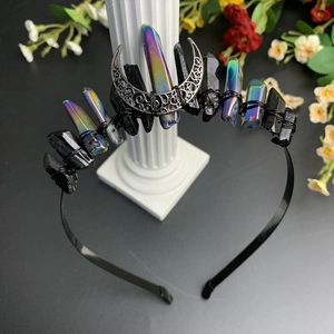 Detail of gothic black moon crown with raw aura quartz and silver crescent moon accent