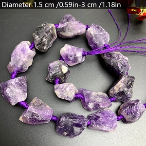 Detailed view of raw purple amethyst stones with 1.5cm to 3cm diameter sizing labels