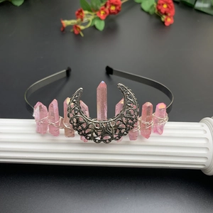 Detail of pink crystal pillars and silver moon wire-wrapped on a bohemian headband