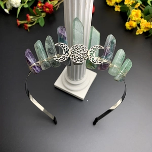 Detailed macro view of handmade crystal crown with triple moon and green fluorite stones