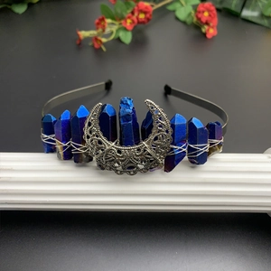 Detailed view of blue crystal moon headband with silver crescent and wire wrapping