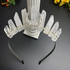 Detail view of handmade natural quartz crystal crown with a silver crescent moon ornament