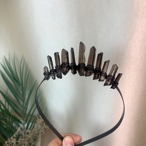 Detail of handcrafted bohemian black metal crown headband with raw smoky quartz crystals