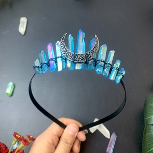 Handmade triple moon crown featuring blue aura quartz crystals on a black metal headband