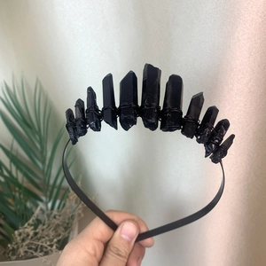Detail of gothic crown with hand-wired black raw crystals on a metal headband base
