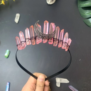 Macro detail of handmade Triple Moon crown with pink crystals and black metallic headband
