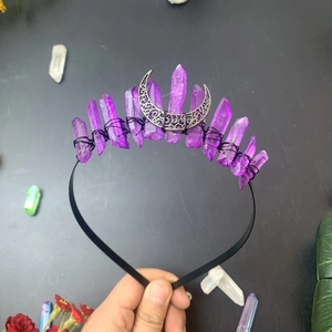 Close-up of handmade triple moon crown with raw purple crystals and silver ornament