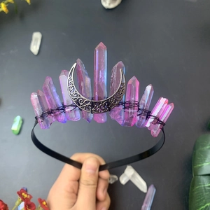 Detail of handmade bohemian crystal crown with purple aura stones and silver crescent moon