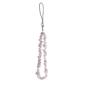 Detailed macro view of purple natural crystal stone chips for phone strap and bag charm