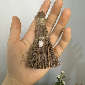 Handmade mini wooden broom decoration featuring a polished pink crystal pendant charm