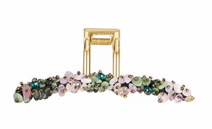 Detailed macro view of hair claw clip with colorful natural crystals and gold alloy spring