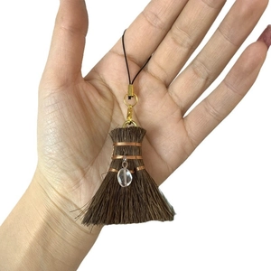 Handmade wizard broom charm with natural fibers, bronze wire and a clear drop bead