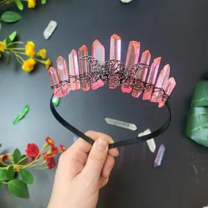 Detailed macro view of handmade pink crystal crown with triple moon metal ornaments