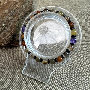 Close-up of 7mm natural mixed gemstone crystal bead bracelet with black spacer beads