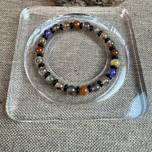 Detail of 7mm natural multi-gemstone beaded bracelet with various crystals and spacers
