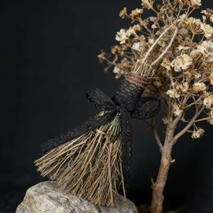Handcrafted decorative mini straw broom with black lace bow and bronze charm accent