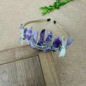 Macro shot of handmade purple crystal headband with silver moon and dragonfly charms